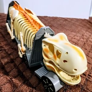 Dinosaur Skeleton Toy Truck - Cream and Orange